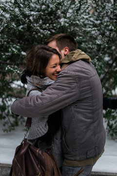 Couple in Love Hugging on the snow