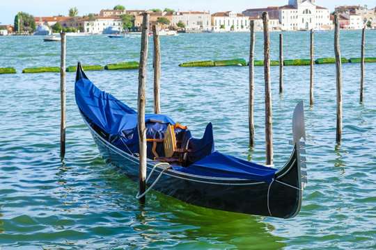 Venice, Italy, May, 31, 2017: gondolas on a channel in Venice, Italy