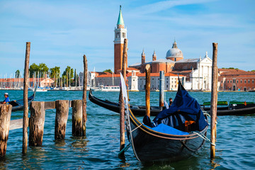 Obraz na płótnie Canvas Venice, Italy - July, 28, 2017: gondola on a Channel in Venice, Italy