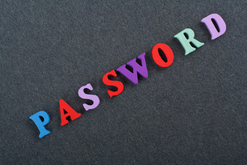 PASSWORD word on black board background composed from colorful abc alphabet block wooden letters, copy space for ad text. Learning english concept.
