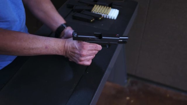 Person takes apart pistol