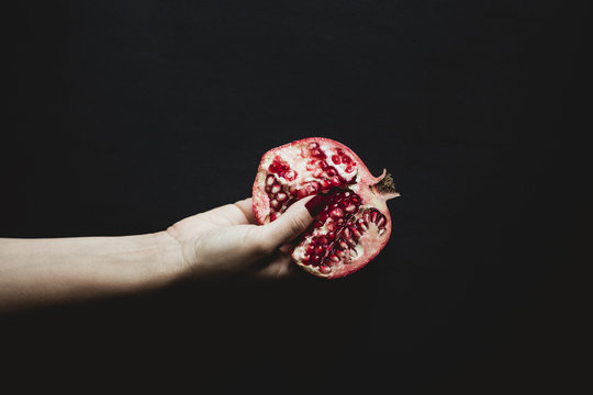 Hand and pomegranate