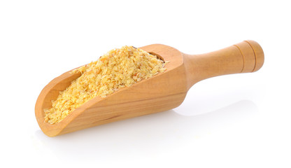 Wheat germ in wood scoop on white background