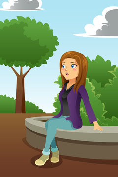 Young Woman Sitting in a Park