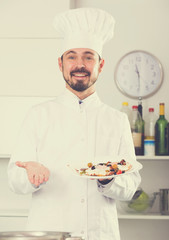 Male cook preparing food