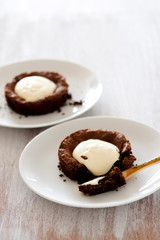 fresh baked choc cakes on wooden table