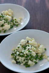 food plate of pasta, ricotta, pesto and basil