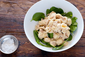food plate of pasta, ricotta, pesto and basil