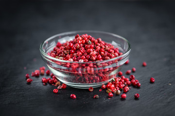 Rustic slate slab with Pink Peppercorns, selective focus