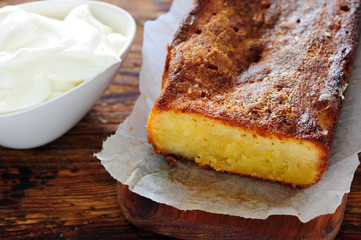 fresh baked lemon cake on wooden table
