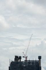 Building construction site with clouds in the sky