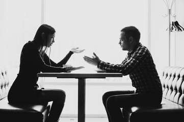 Man and woman in discussions in the restaurant