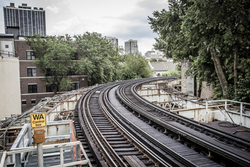 Naklejka premium Curving track around bend with trees
