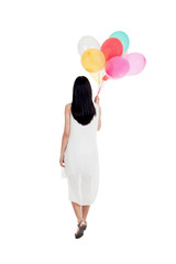 Young woman with colorful balloons isolated on white background