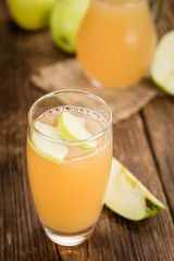 Apple Juice on vintage wooden background