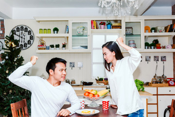 Young couple in quarrel in the kitchen