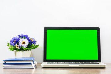 Laptop blank screen for text or pictures on wooden table. Concept for advertising, business and home office.
