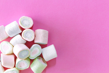 Marshmallow on pink background with copy space