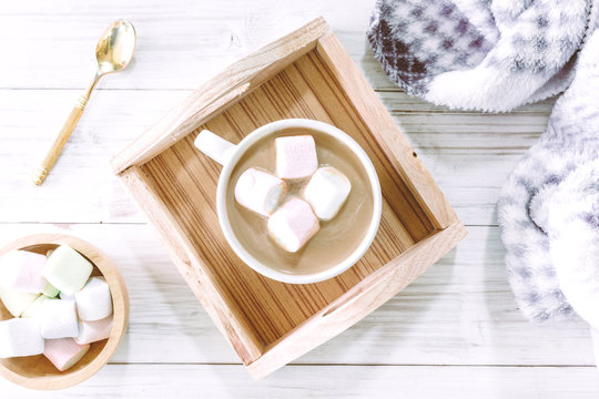 Hot chocolate and marshmallow on wooden background