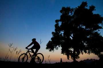Biking exercise with silhouette activty. Bike outdoor.