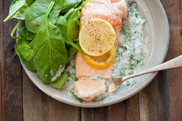 balanced meal with salmon, salad and lemon