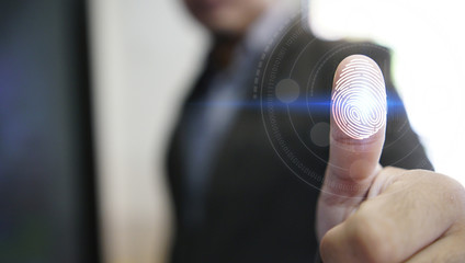 Businessman login with fingerprint scanning technology. fingerprint to identify personal, security system concept
