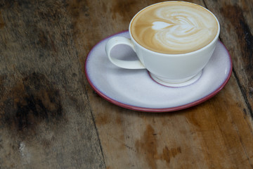 Top view of white coffee cup on wooden table for business and relaxing