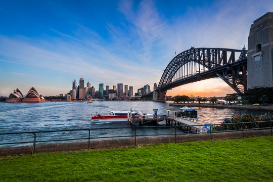 Panoramic view of Sydney Harbour at sunset with the two icons, the Sydney Harbour Bridge and Opera House from North Sydney in Australia