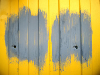 Paint splatters on yellow wall