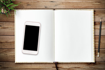 Top view of blank paper page on wood background office desk and different objects. Minimal flat lay style