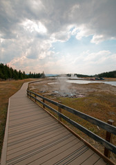 Elevated boardwalk / walkway leading to Firehole Lake in the Lower Geyser Basin in Yellowstone National Park in Wyoming United States