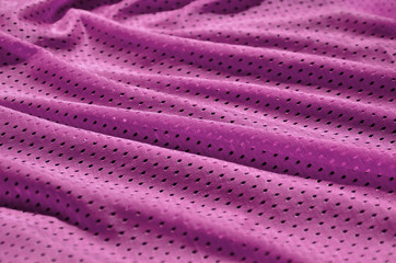 Fototapeta na wymiar Texture of sportswear made of polyester fiber. Outerwear for sports training has a mesh texture of stretchable nylon fabric