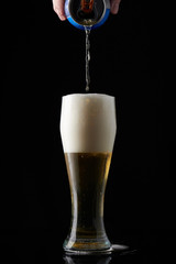 Pouring beer from metal can 