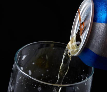 Macro Of Pouring Beer From Tin Can