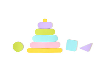 Wooden stacking ring toy paper cut on white background - isolated
