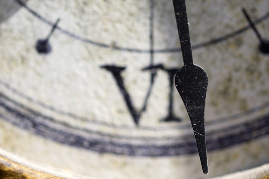 time:closeup of the roman number of a clock