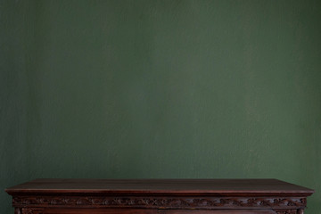 Empty table top and wood shelf or table top and green retro wall. Blank screen and copy space for products or graphic montage.