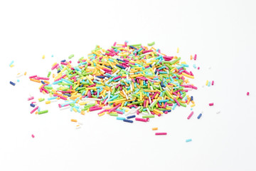 colorful sugar sprinkles on white