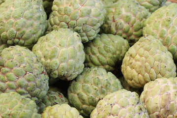 group of green fresh organic custard apple at asia fresh market, sweet taste fruit, backgrounds, tropical climate fruit, 