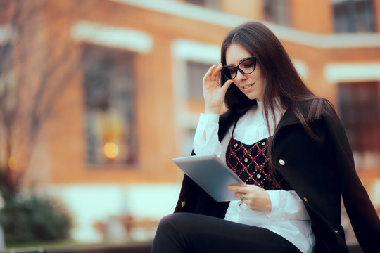 Business Woman with Reading Glasses and Tablet PC Outside 
