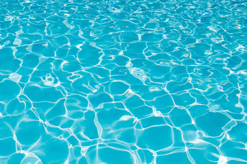 Blue water surface in swimming pool for background