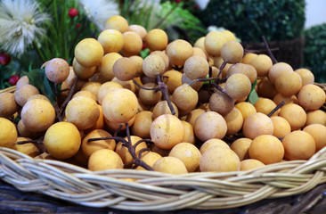 plastic Longan model and plastic wollongong fruit or Lansium parasiticum model in the black brown rattan basket. For show Because it is not rotten.