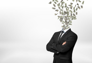A businessman with forded hands and many dollar bills flying out in place of his head. - obrazy, fototapety, plakaty