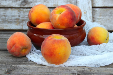 Sweet, honey peaches. Fresh fruit on a wooden table.