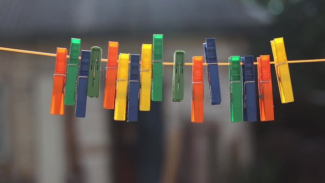 Abstract  backdrop with close up clothes pegs in Sunset light.