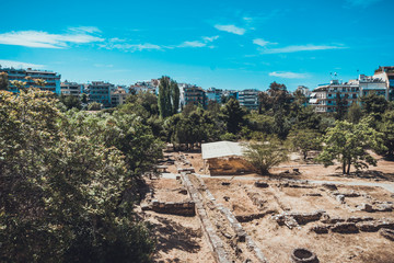 Archaeological excavation site at edge of city