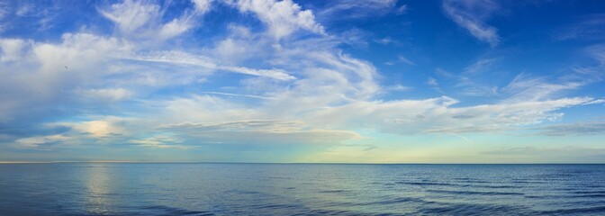 Fototapeta premium panoramic view rippled surface of cold sea at sunrise 