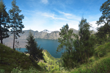 Fototapeta na wymiar Blue Segara Anak lake on the crater of Mount Rinjani