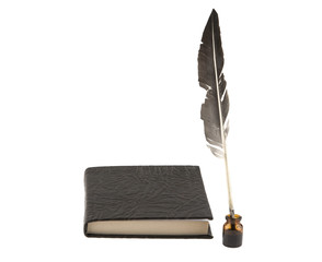 Notepad and  feather with ink