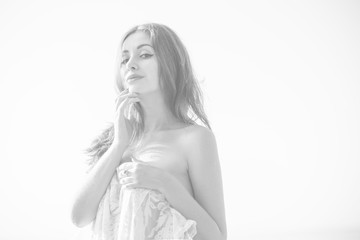 Beautiful tender young lady at evening sunlight around forest and sand. Woman wearing and lace cloth. Portrait in vintage style. Sweet woman on white background